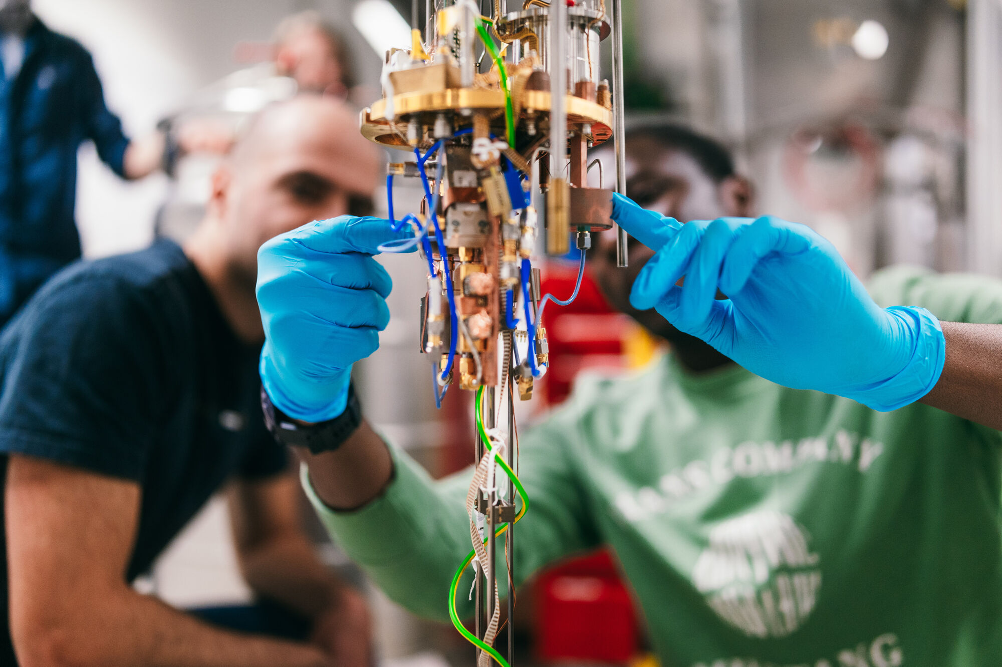 Physical test arrangement, two persons in the background, blurred.