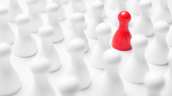 Red pawn among others on white background, closeup. Recruiter searching employee